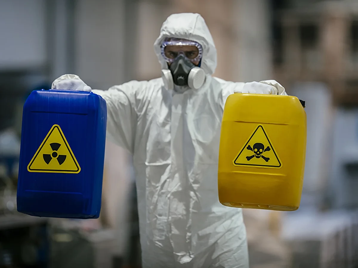Biohazard cleanup technicians in protective equipment at a remediation scene in West Bend, WI